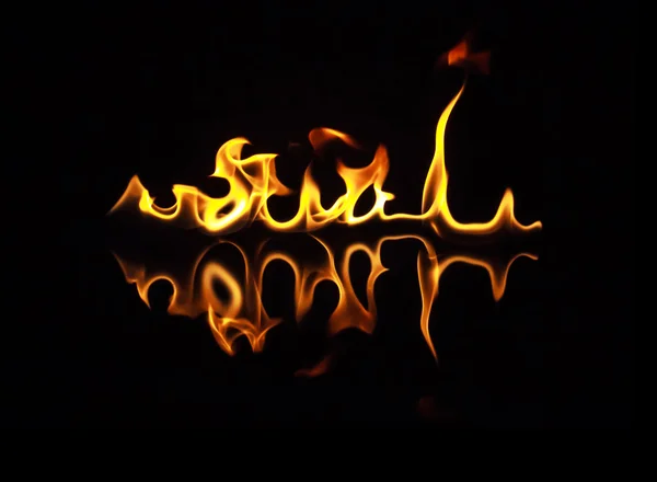 Fire flames on a black background — Stock Photo, Image