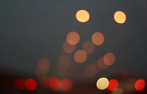 Абстрактний круглий боке фон автомобільного світла на дорозі — стокове фото