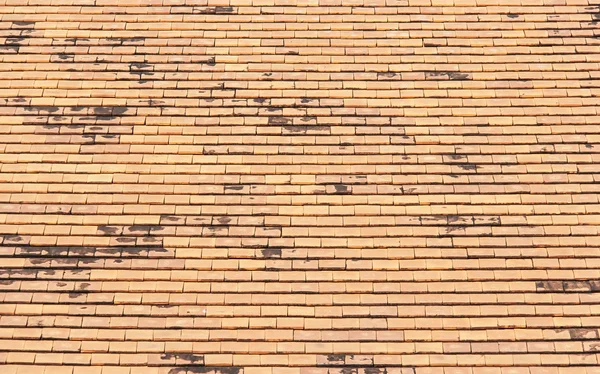 Old roof tiles made of terracotta as background — Stock Photo, Image