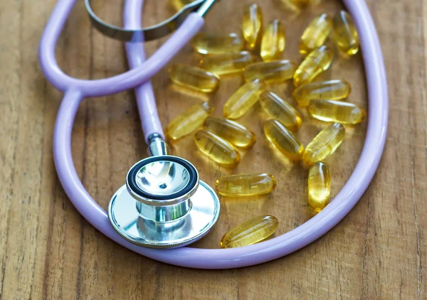 Stethoscope with fish oil — Stock Photo, Image