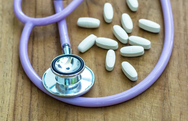 Stethoscope with medicine — Stock Photo, Image