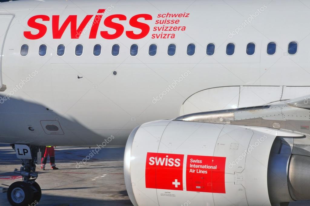 BARCELONA, SPAIN - DECEMBER 26: Swiss Boeing 737 waits for passenger in airport Prat on December 26, 2012. Swiss is a flagship carrier of Switzerland.