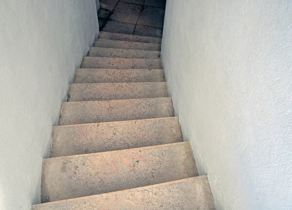 Stairs going down between walls