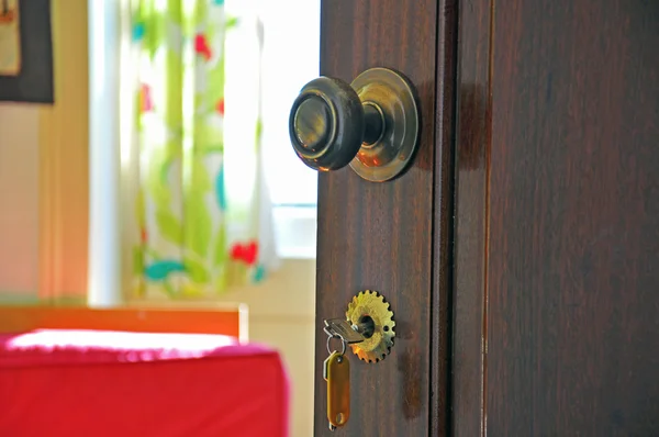 Opened door with keys — Stock Photo, Image