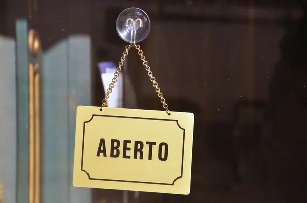 "Open" sign in portuguese cafe — Stock Photo, Image