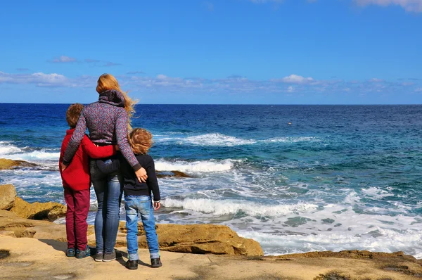 Woman hugging her sons — Stock Photo, Image