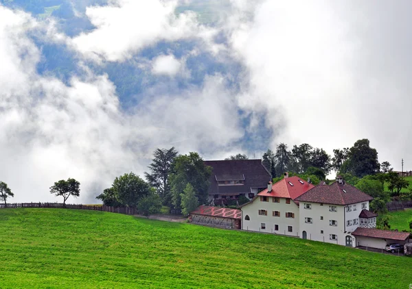 Alpine house in clouds — Stock Photo, Image