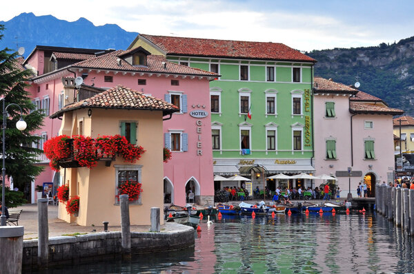 NAGO-TORBOLE, ITALY - JULY 27: Colorful buildings in old town of Nago-Torbole, Italy on July 27, 2014. Nago-Torbole is a resort on northern part of Garda lake in Italy.