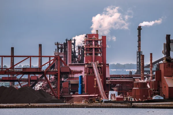 Smoking pipes of industrial plant on the lake — Stock Photo, Image