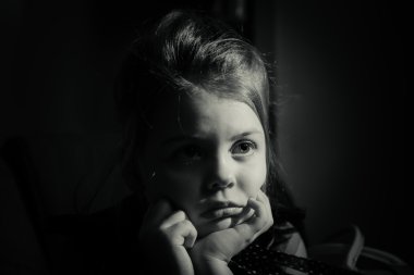 Monochrome portrait of lonely sad little girl clipart