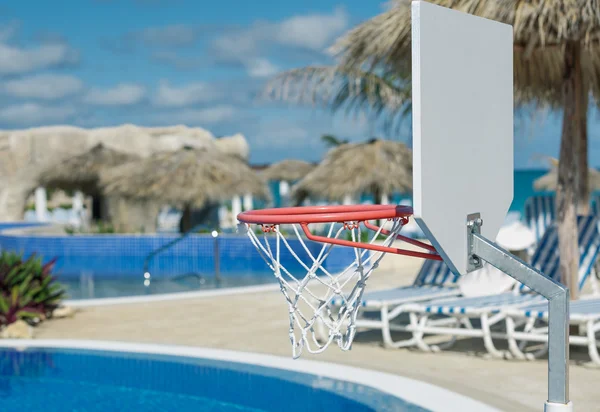 Basketball net  alluminum stand over swimming pool — Stock Photo, Image