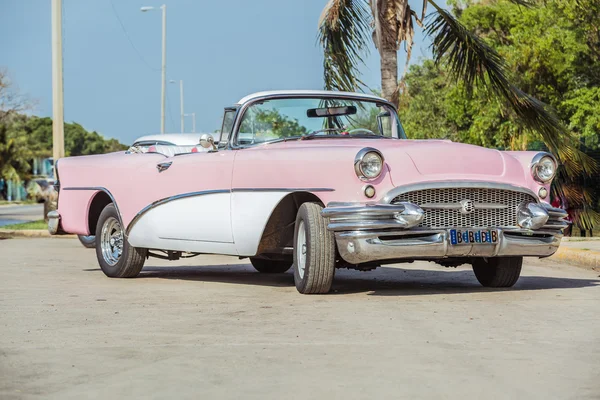 Old vintage pink & white classic car — Stock Photo, Image