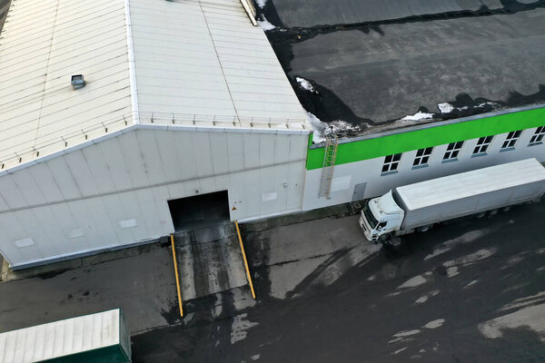The truck is waiting to be loaded at the factory top view.
