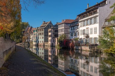 Strasbourg, France - October 24, 2021: Half-timbered houses of the Petite France district, taken on a sunny autumn afternoon with some unrecognizable people