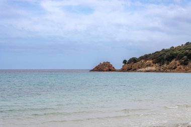 On the beach of Spiaggia di Porto Tramatzu, island of Sardinia, Italy