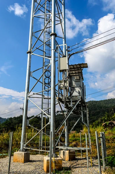 Transformer with Electric Poles on Mountain.