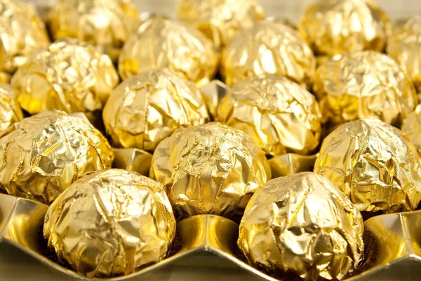 Goldne foil candy — Stock Photo, Image