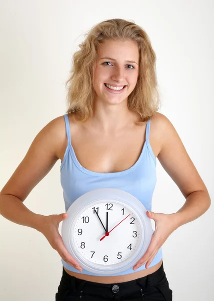 Woman with a clock Royalty Free Stock Images