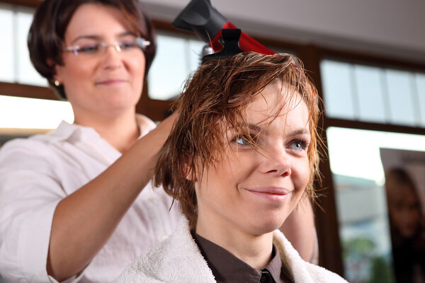 Woman at hairdresser.