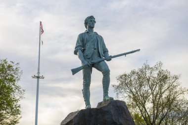 Minute Man Statue in Battle Green in historic town center of Lexington, Massachusetts MA, USA. 