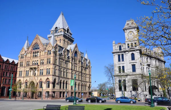 Syracuse Savings Bank Building (left) and Gridley Building (right) at Clinton Square in downtown Syracuse, New York State NY, USA. Syracuse Savings Bank Building was built in 1876 with Gothic style.