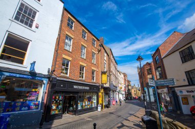 Historic commercial buildings on Saddler Street in historic city center of Durham, England, UK. The Durham Castle and Cathedral is a UNESCO World Heritage Site since 1986. 