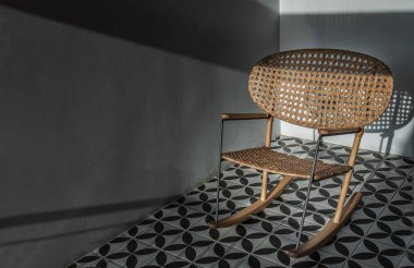 Relaxing wicker rattan rocking chair on balcony. Furniture weave rattan chair, Copy space, Selective focus