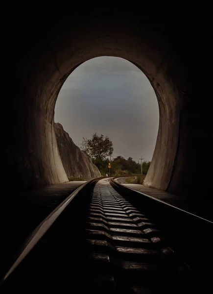 Inside the railroad tunnel and railways with natural light at the end. Light at the end of the tunnel, Lights and shadows, Concept of achieving your goals, Copy space, No focus, specifically.