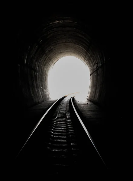 Inside the railroad tunnel and railways with natural light at the end. Light at the end of the tunnel, Lights and shadows, Concept of achieving your goals, Copy space, No focus, specifically.