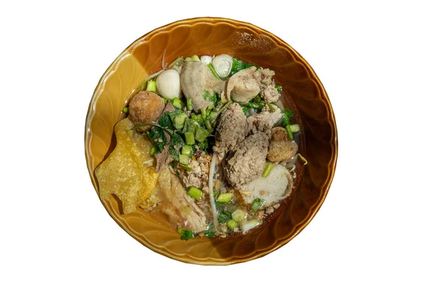 Traditional thin rice noodles soup (Small noodles soup) with fish ball, shrimp meatball, steamed ground pork and fried wonton in brown bowl isolated on white background with clipping path. Top view, Asian style food, Selective focus.