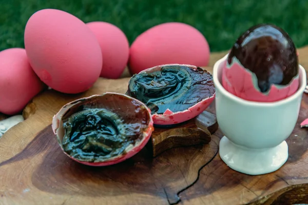 Asian Traditional Food, Pink Century eggs (Pidan Eggs) also known as preserved egg, hundred-year egg, thousand-year egg are a Chinese preserved food product and delicacy made by preserving duck, chicken in A Mixture of Ash, Salt, Red Lime, Sodium Car