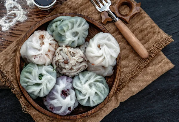 Chinese chives Dumplings Mixed Color or Garlic Chives Dim Sum Rice Cake inside with Taro Slice ,Bamboo shoot and Many kind of vegetable inside the flour, Steamed Served Sweet Black Soy Sauce Chinese Food Style side view, Chinese Food Appetizer dish S