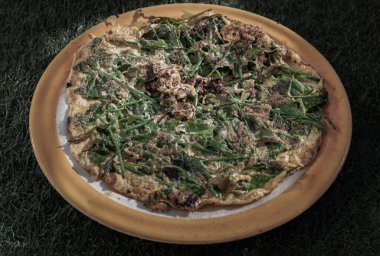 Fried Egg with Vegetable fern or Vegetable fern Omelettes on Ceramic plate. Local food, No focus, specifically.