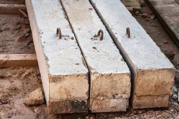 Reinforced concrete beams for building structures stacked at a construction site