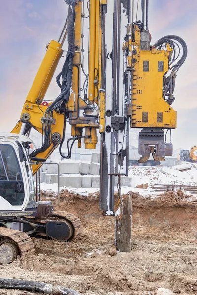 A powerful drilling rig for peeling at a construction site. Operation of the drilling rig in northern conditions. Pile foundations. Bored piles