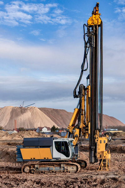 A powerful drilling rig for peeling at a construction site. Operation of the drilling rig in northern conditions. Pile foundations. Bored piles