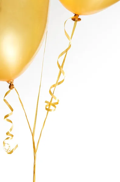 Gouden ballonnen en lint Rechtenvrije Stockfoto's