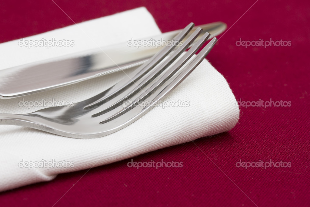 Cutlery on white folded napkin