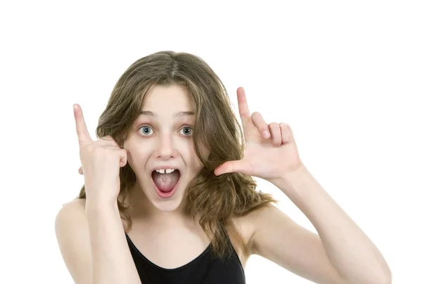 Young girl looking at camera making hand gestures — Stock Photo, Image