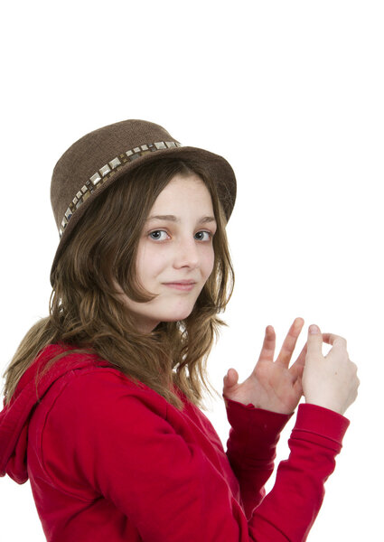 Young girl posing with a hat