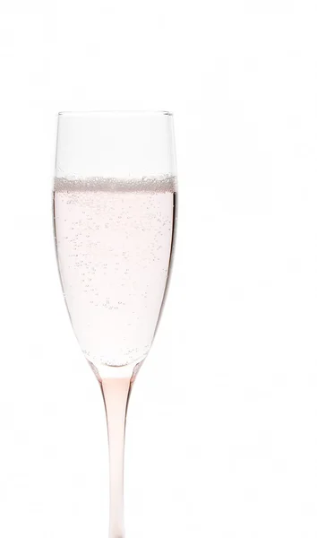 Glass of pale pink champagne on white background — Stock Photo, Image