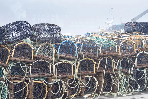 Crab or lobster pots on foggy quayside — Stock Photo, Image