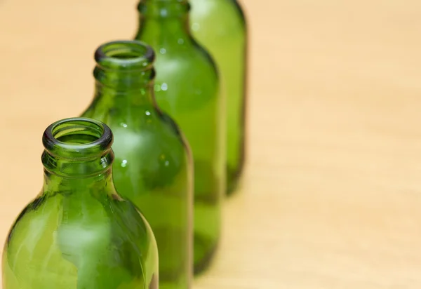 Top of four green bottles — Stock Photo, Image