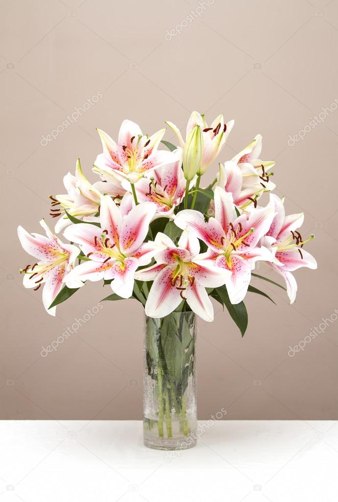 Bouquet of pink lillies in a glass vase