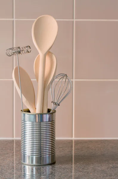 Kitchen utensils in a can with tile background — Stock Photo, Image