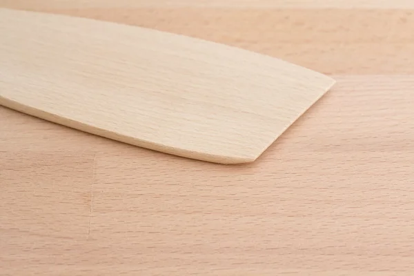 Wooden spatula on a chopping board — Stock Photo, Image