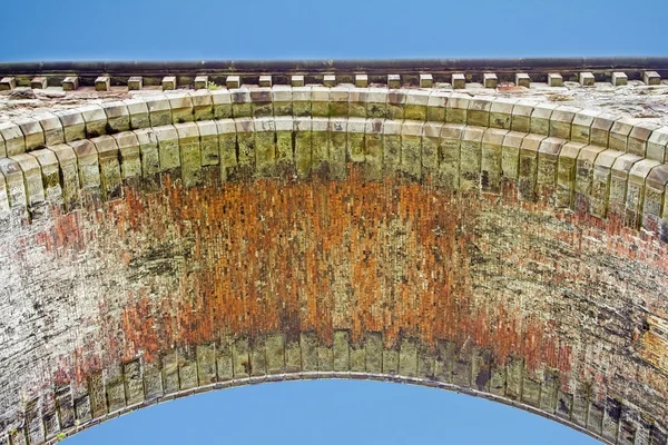 Underneath a bridge arch — Stock Photo, Image
