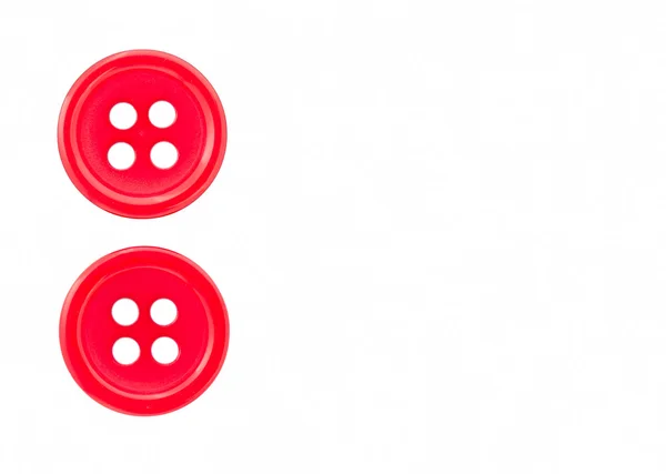 Dos botones rojos sobre un fondo blanco — Foto de Stock