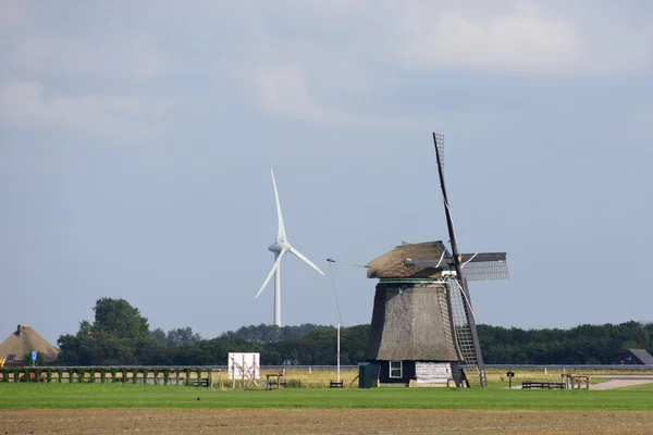 Old and new windmills — Stock Photo, Image