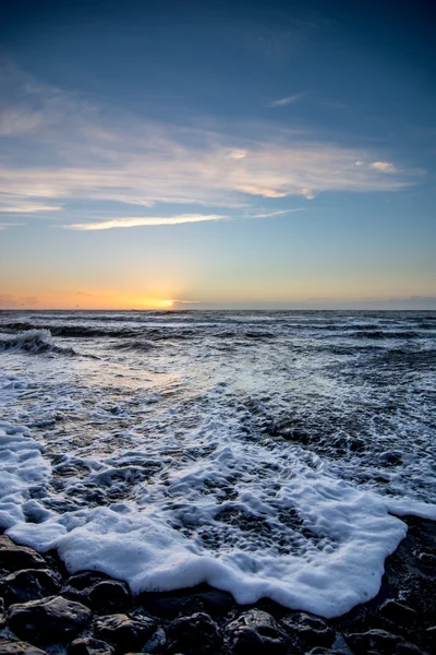 Solnedgången över nederländska beach — Stockfoto